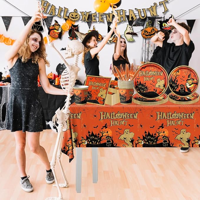 Vintage Halloween party tableware laid out on a dining table